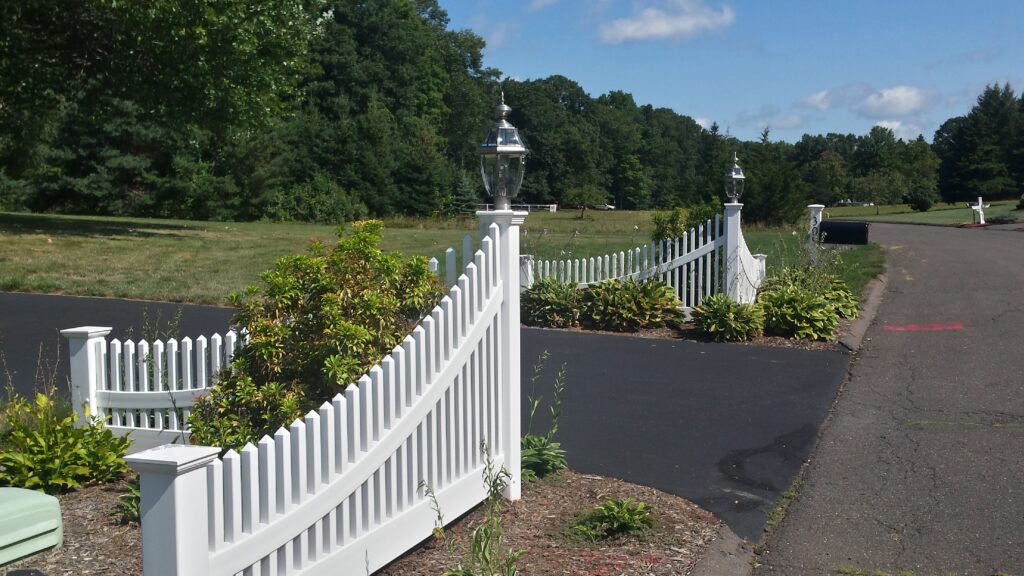 Solid White Vinyl Picket Entraceway With Lamp Posts