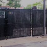 6_ H Black Vinyl Coated Chain Link Dumpster Enclosure with Privacy Slats 2