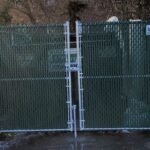 6_ H Chain Link Dumpster Enclosure With Green Privacy Slats